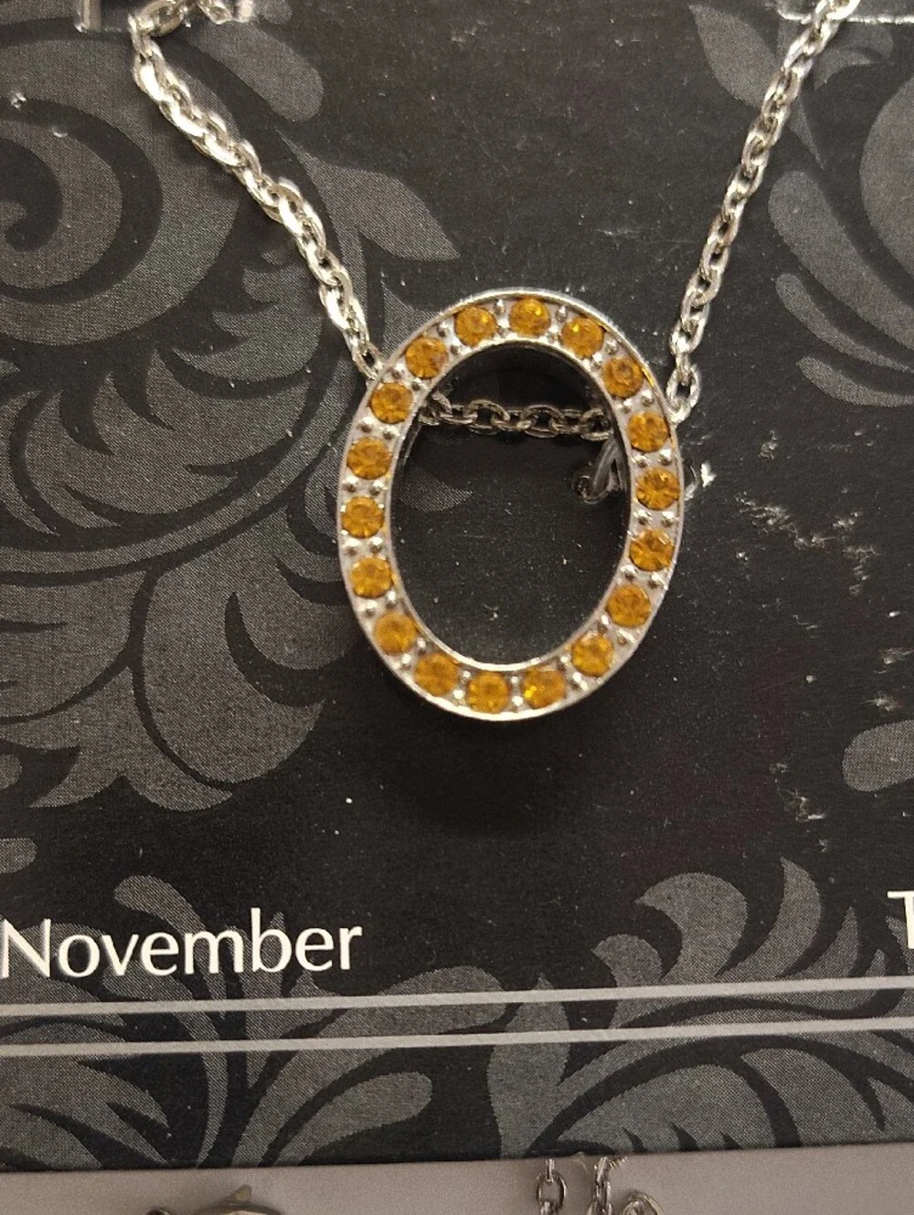 GANZ Silver Necklace with Orange Topaz Circle Pendant